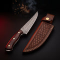Hand forged Damascus boning knife with a 7 inch curved blade, rosewood handle and a stamped leather sheath