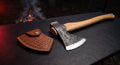 Hand forged bushcraft axe with a hammer poll, 19 inch oak handle and a stamped leather head cover