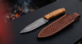 Damascus bushcraft knife with a twist pattern spear point blade, olive wood handle and a stamped leather sheath