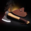 Hand forged carbon steel viking bearded axe with leather wrapped ash handle and tooled leather head cover