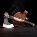 Hand forged carbon steel viking hatchet with charred wood handle and tooled leather head cover