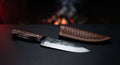 Hand forged chef knife with a 6 inch blade, dark forged spine and a walnut handle