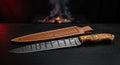 Damascus slicing knife with a very long narrow ladder pattern blade and an olive wood handle
