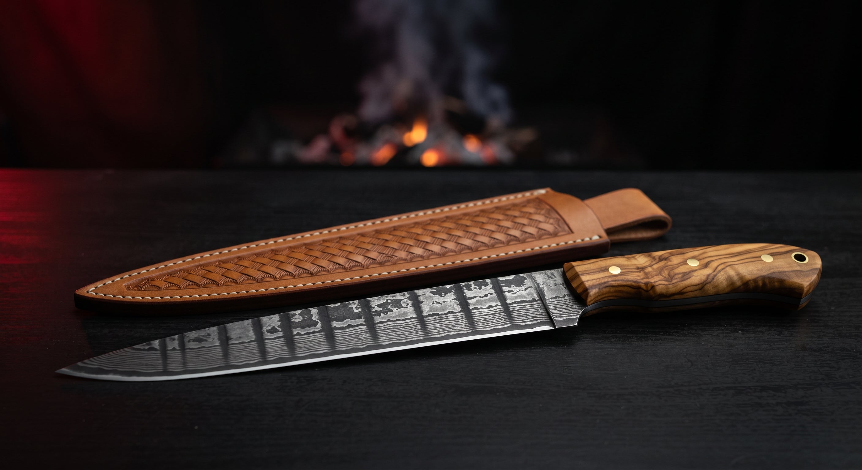 Damascus slicing knife with a very long narrow ladder pattern blade and an olive wood handle