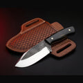 rasp steel bull cutter knife with black horn handle and tooled pancake sheath