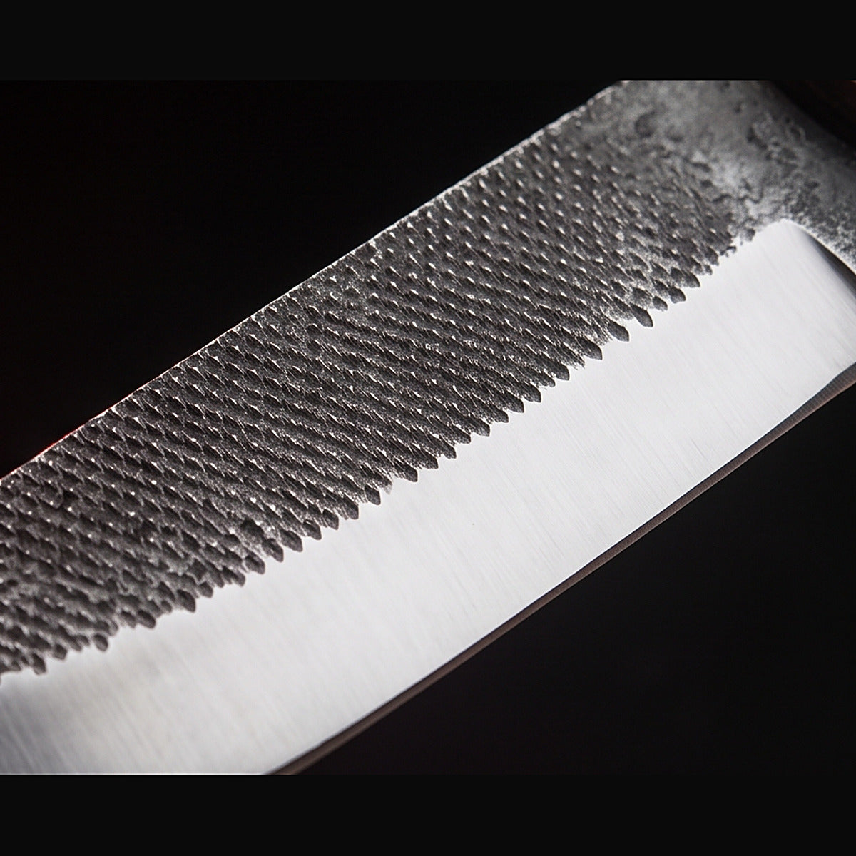 rasp steel bull cutter knife with rosewood handle, blade surface macro
