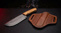 Damascus ranch knife with a raindrop pattern blade, deep belly, olive wood handle and a basket weave pancake sheath