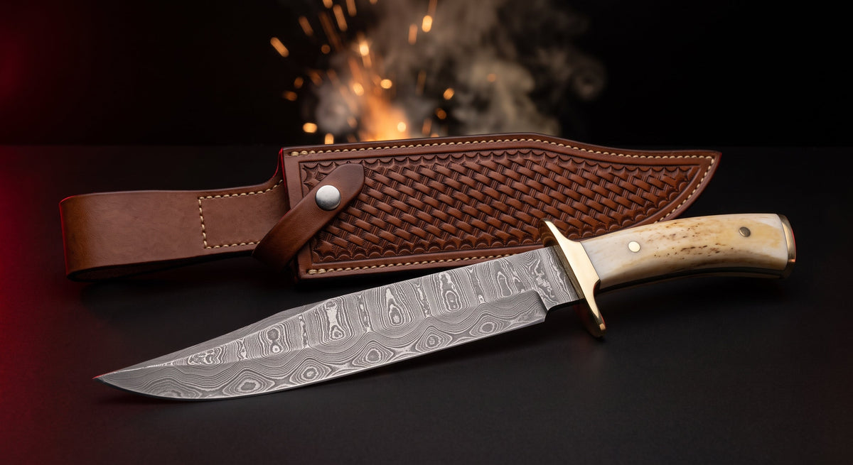 Damascus bowie knife with camel bone handle, brass guard and tooled leather belt sheath