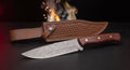 Damascus camp knife with rosewood handle and tooled leather belt sheath