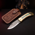 Damascus folding knife with camel bone and turquoise handle and tooled leather pouch