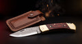 Damascus folding pocket knife with rosewood handle and tooled leather pouch