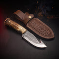Damascus gut hook skinner knife with elk antler crown handle and carved leather belt sheath