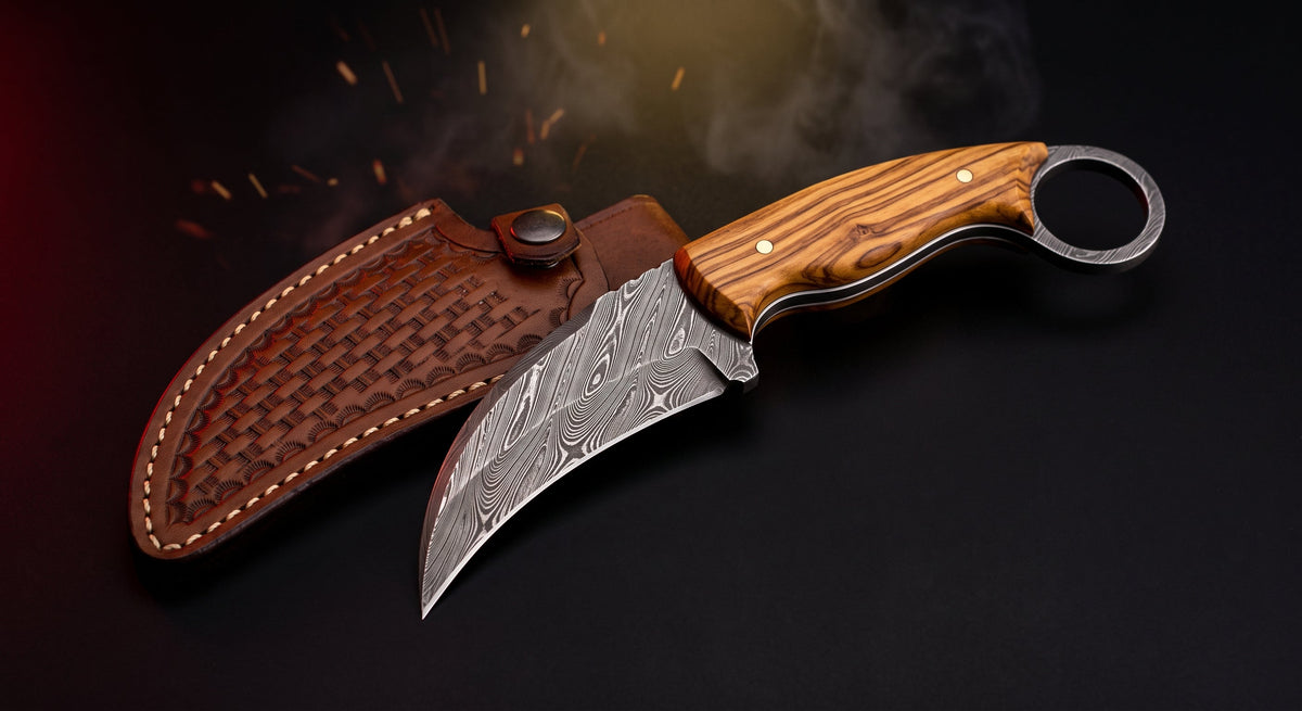 Damascus karambit knife with olive wood handle, finger ring and tooled leather sheath