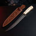 Damascus fillet knife with a 7.5 inch blade, camel bone handle and a hand carved leather sheath