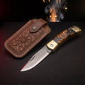 Damascus gentlemans folding knife with burl wood and resin handle and tooled leather pouch
