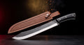 Hand forged breaking knife with black micarta handle and tooled leather sheath