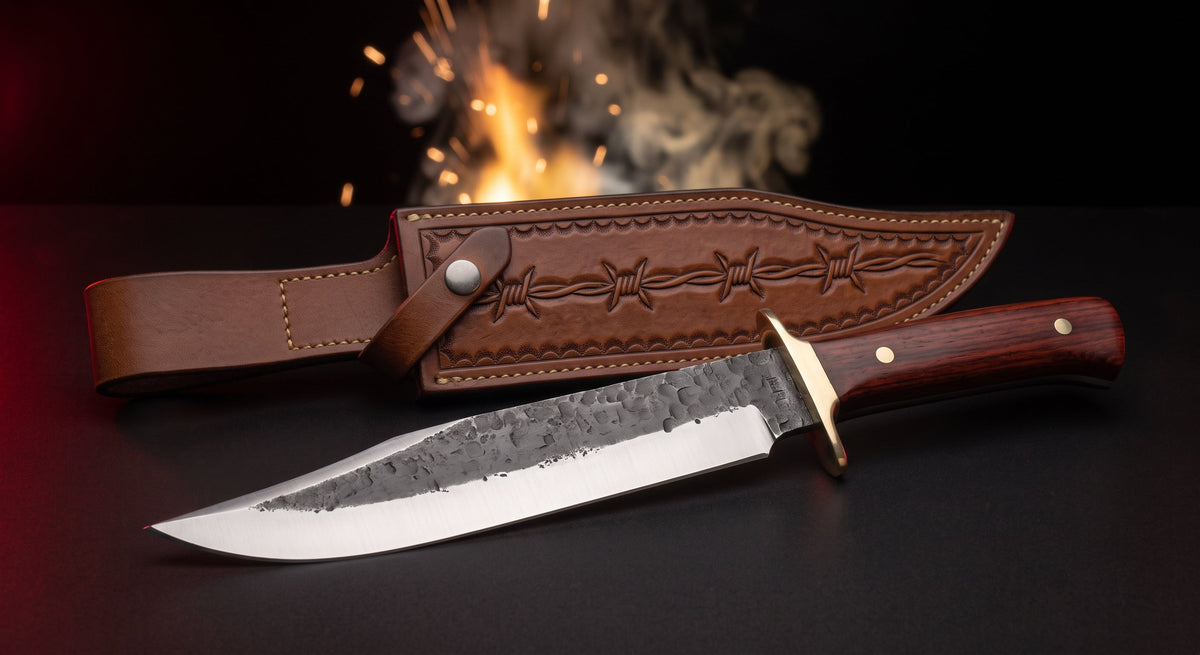 Hand forged carbon steel bowie knife with rosewood handle, brass guard and tooled leather belt sheath
