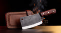Hand forged carbon steel meat cleaver with rosewood handle and tooled leather blade cover