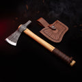 Hand forged carbon steel tomahawk with leather wrapped ash handle and tooled leather head cover