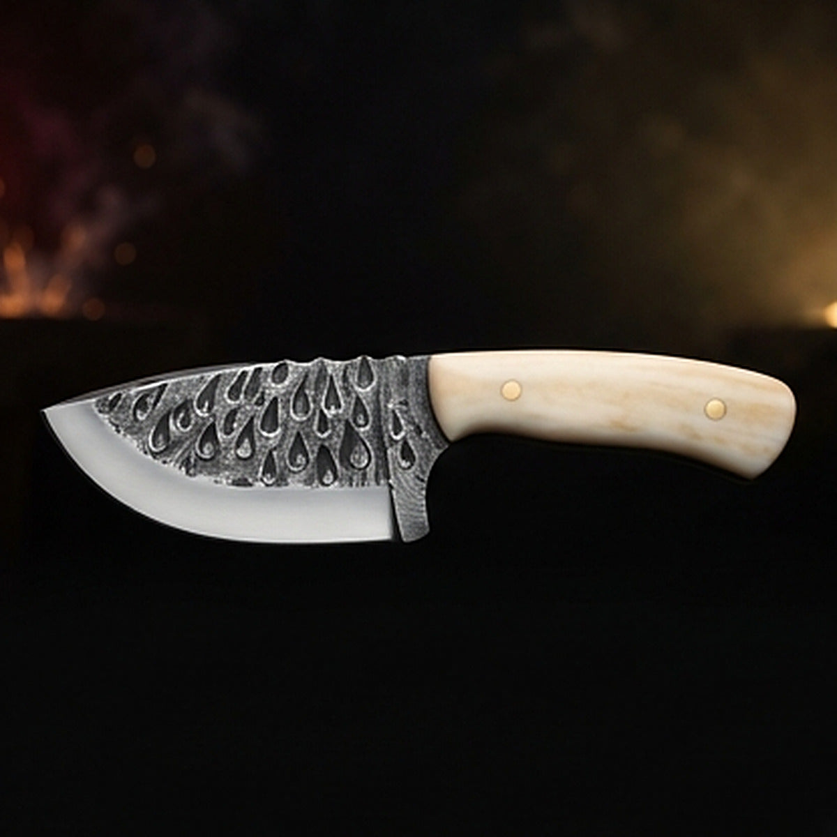 Damascus steel skinning knife with polished camel bone handle and brass pins, left side profile