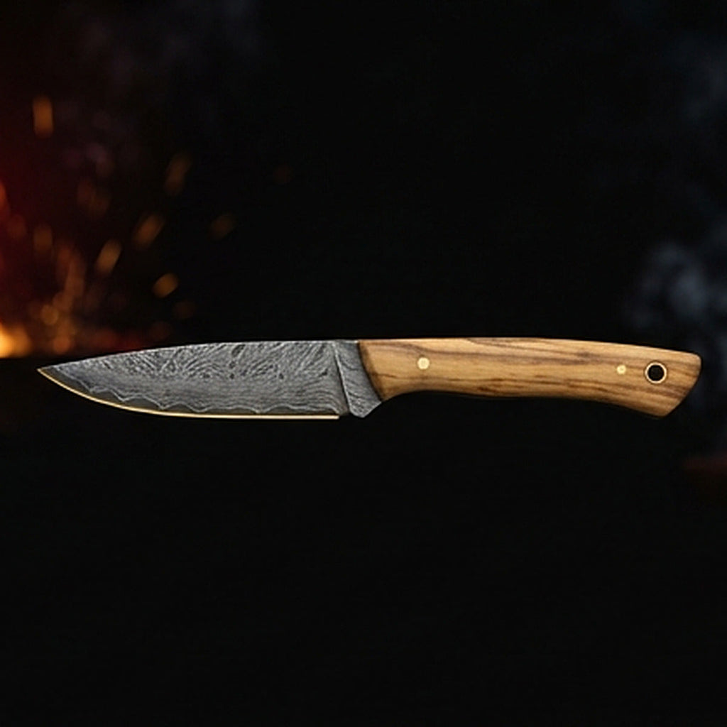 Damascus steel bird and trout knife with slim olive wood handle and brass pin, right side profile