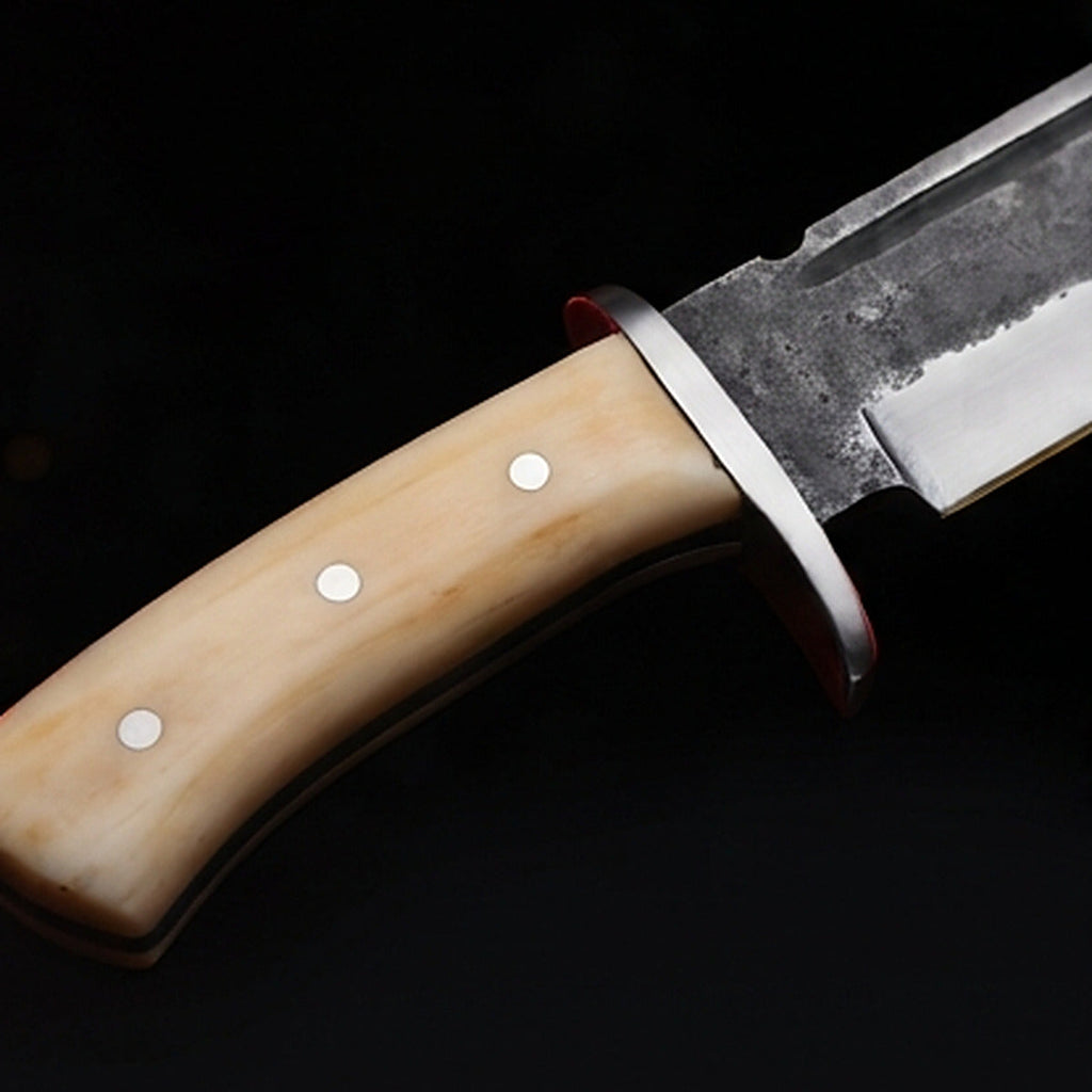 1095 high carbon steel bowie knife with cream bone handle and polished steel guard, handle close up