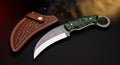 D2 steel karambit knife with green resin handle, finger ring and tooled leather sheath