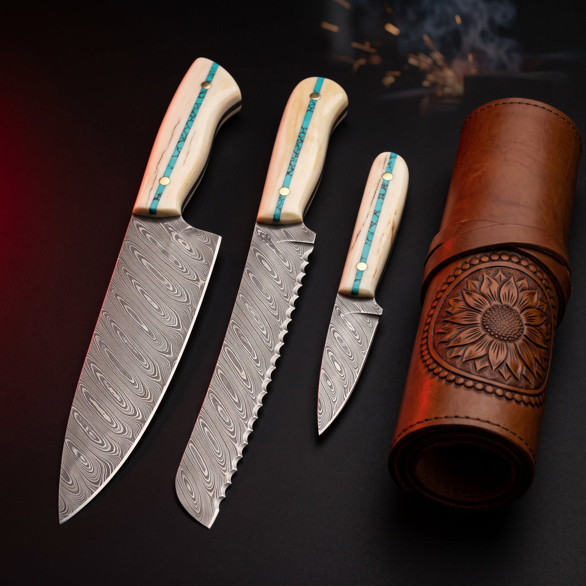 Damascus kitchen knife set of 3 with bone and turquoise handles in a carved leather knife roll