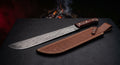 Damascus machete with a 17 inch twist pattern blade, upswept tip, rosewood handle and a stamped leather sheath