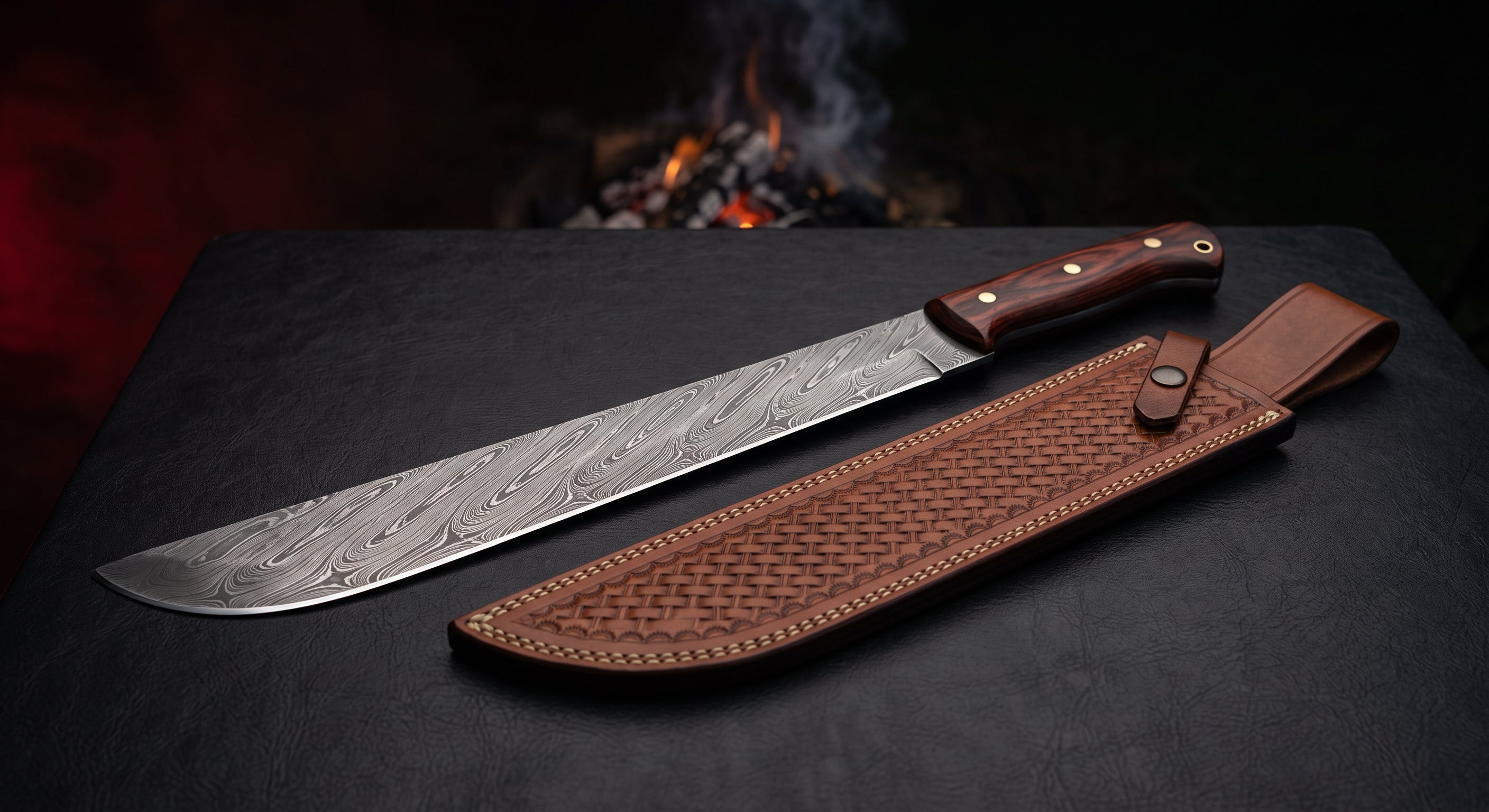 Damascus machete with a 17 inch twist pattern blade, upswept tip, rosewood handle and a stamped leather sheath