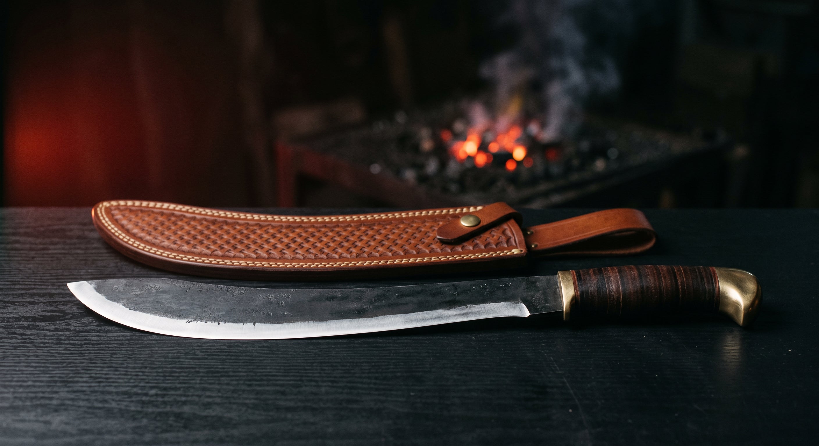 Hand forged parang machete with a forward curving blade, stacked leather handle and a stamped leather sheath