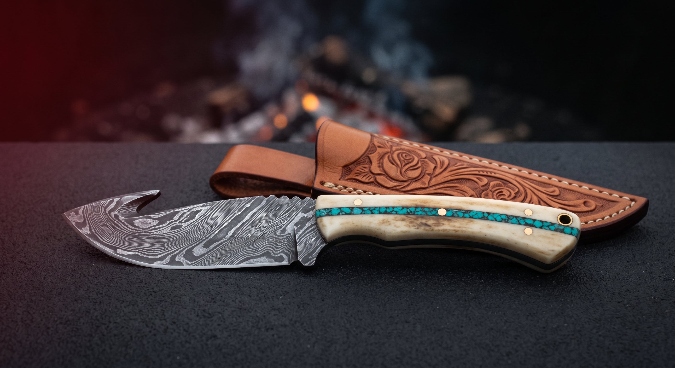 Damascus gut hook skinner with a twist pattern blade and a camel bone handle with a crushed turquoise inlay