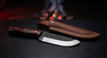 Rasp steel skinner knife with the original rasp teeth showing across the flat and a rosewood handle