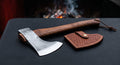Hand forged throwing axe with a bearded head, 16 inch walnut handle and a stamped leather cover