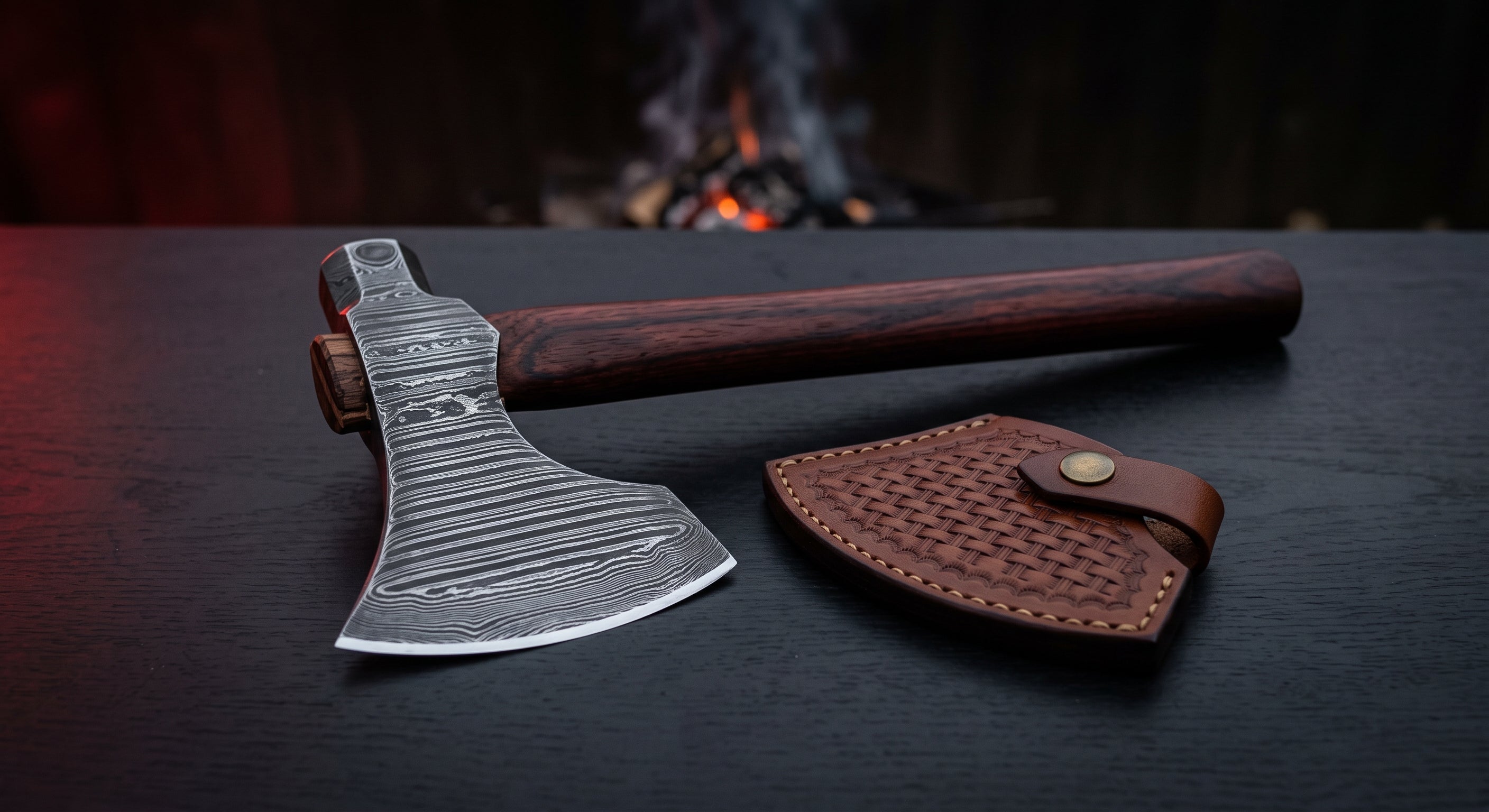 Damascus throwing hatchet with a ladder pattern head, rosewood handle and a stamped leather cover