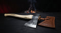Hand forged viking bearded axe with a deep beard, 24 inch ash handle and a stamped leather head cover