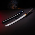 Hand forged 1095 wakizashi with black lacquered saya and black cord wrapped handle